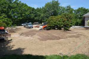 The circular driveway mound is graded