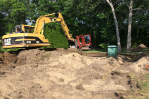 Excavating the propane tank for driveway